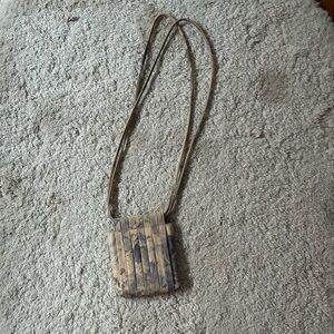 Beklina pleated leather floral print bag